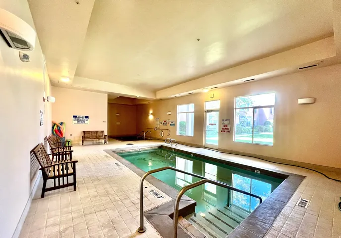Indoor community pool with a wall unit AC