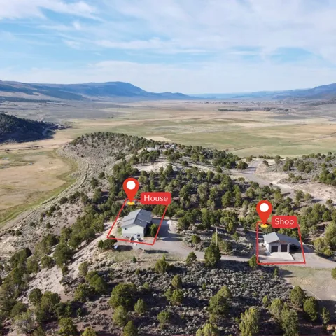 Aerial view of sparsely populated area featuring a mountain backdrop
