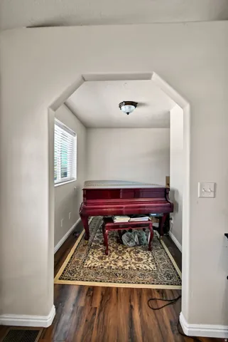 Dining area featuring baseboards and dark wood finished floors