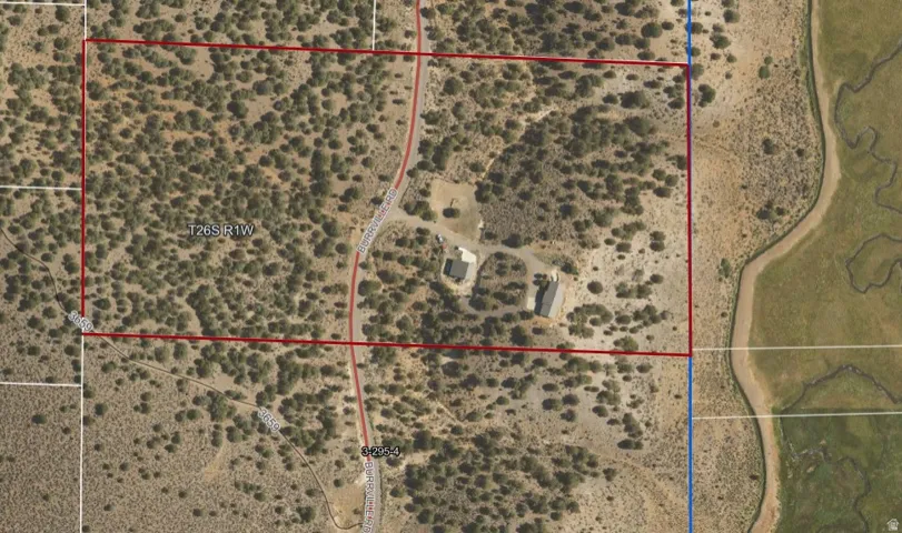 Aerial map of property and surrounding area with property parcel outlined