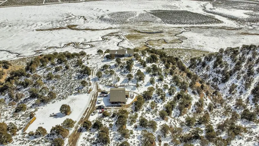 Snowy aerial view featuring a view of countryside