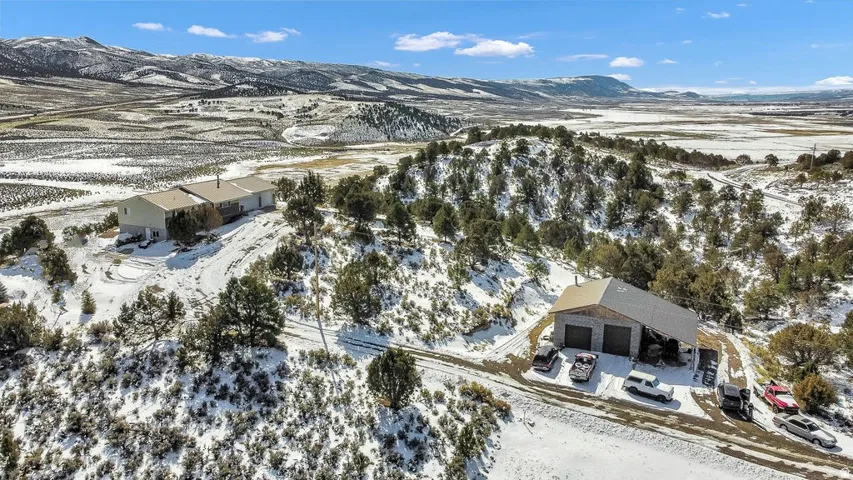 Snowy aerial view featuring a mountain view