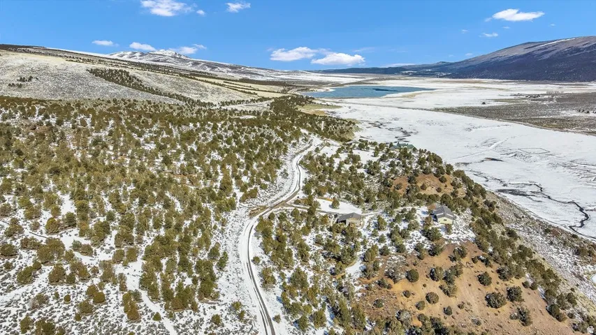 Snowy aerial view featuring a mountain view