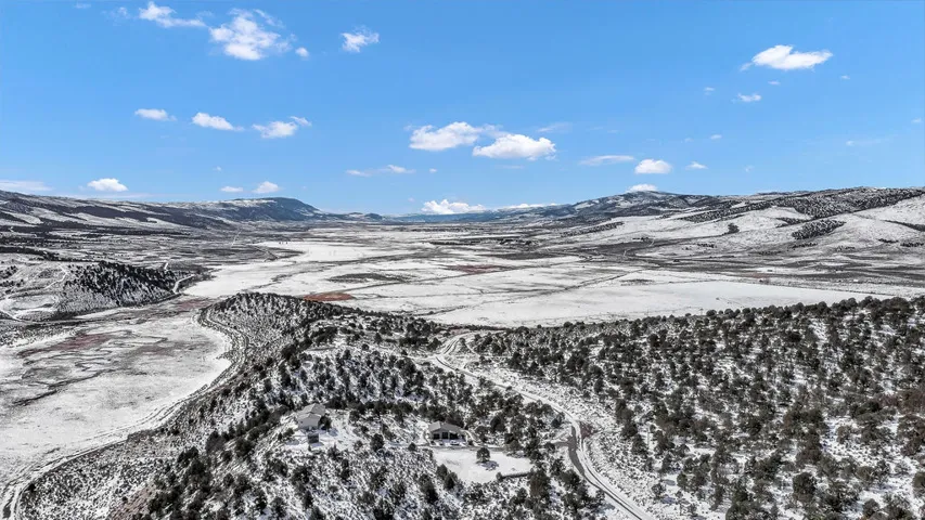 Snowy aerial view with a mountain view