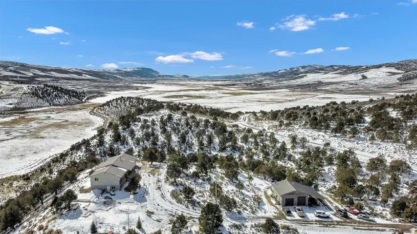 Snowy aerial view featuring a mountain view