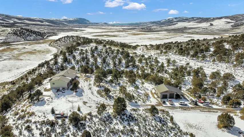 Snowy aerial view featuring a mountain view
