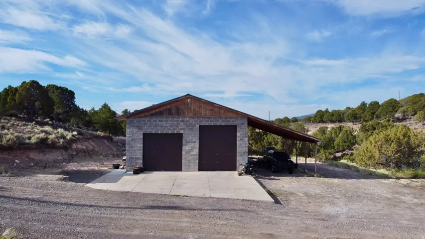 Garage with a detached garage and driveway