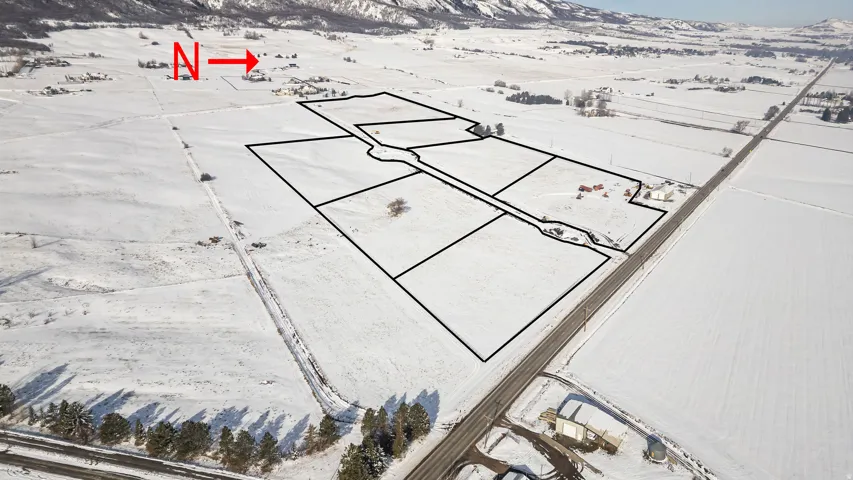 Snowy aerial view featuring a mountain view