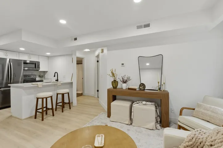 Living room featuring recessed lighting and light wood-type flooring