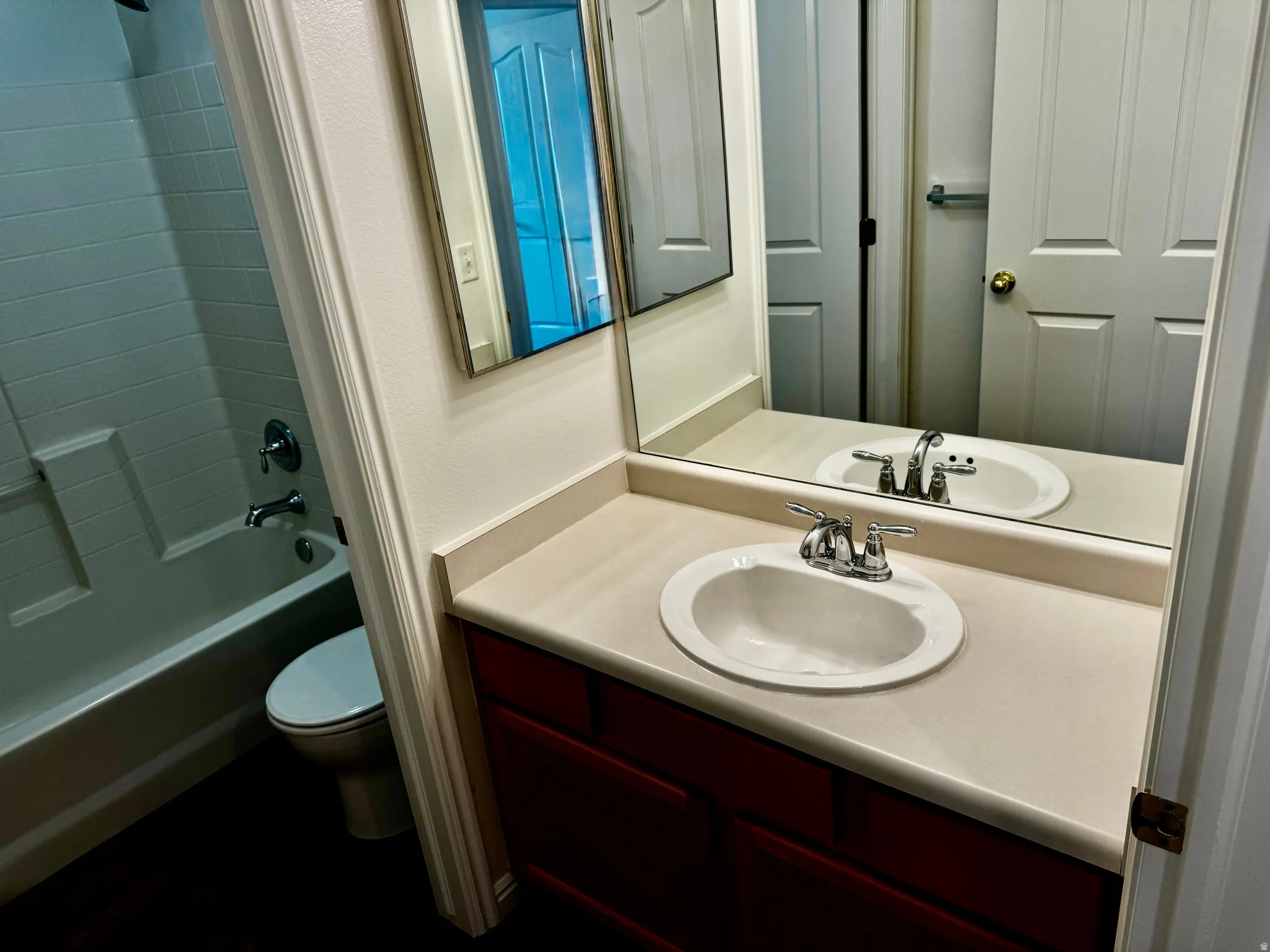 Full bathroom with vanity and washtub / shower combination