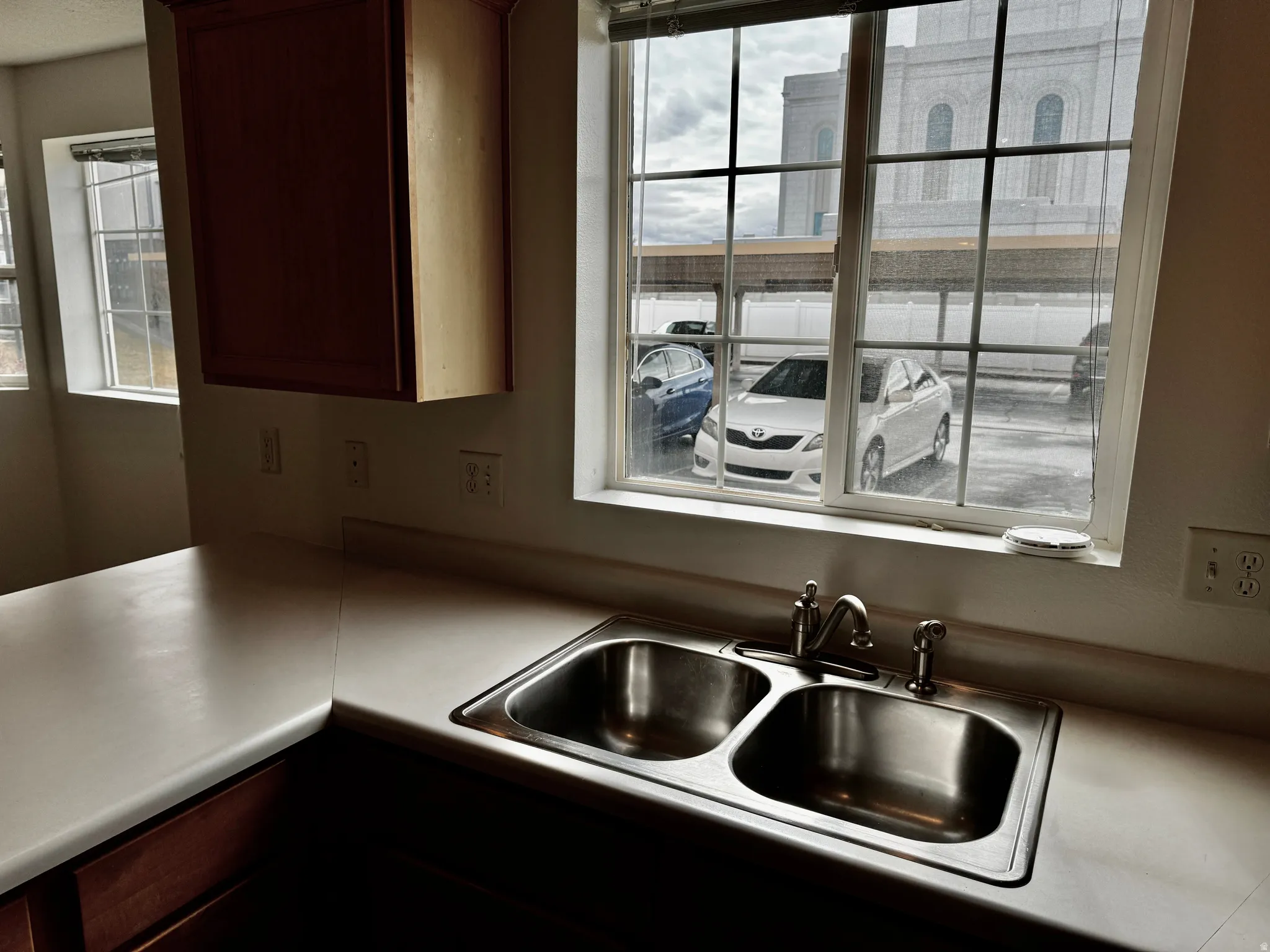 Kitchen with a sink and light countertops
