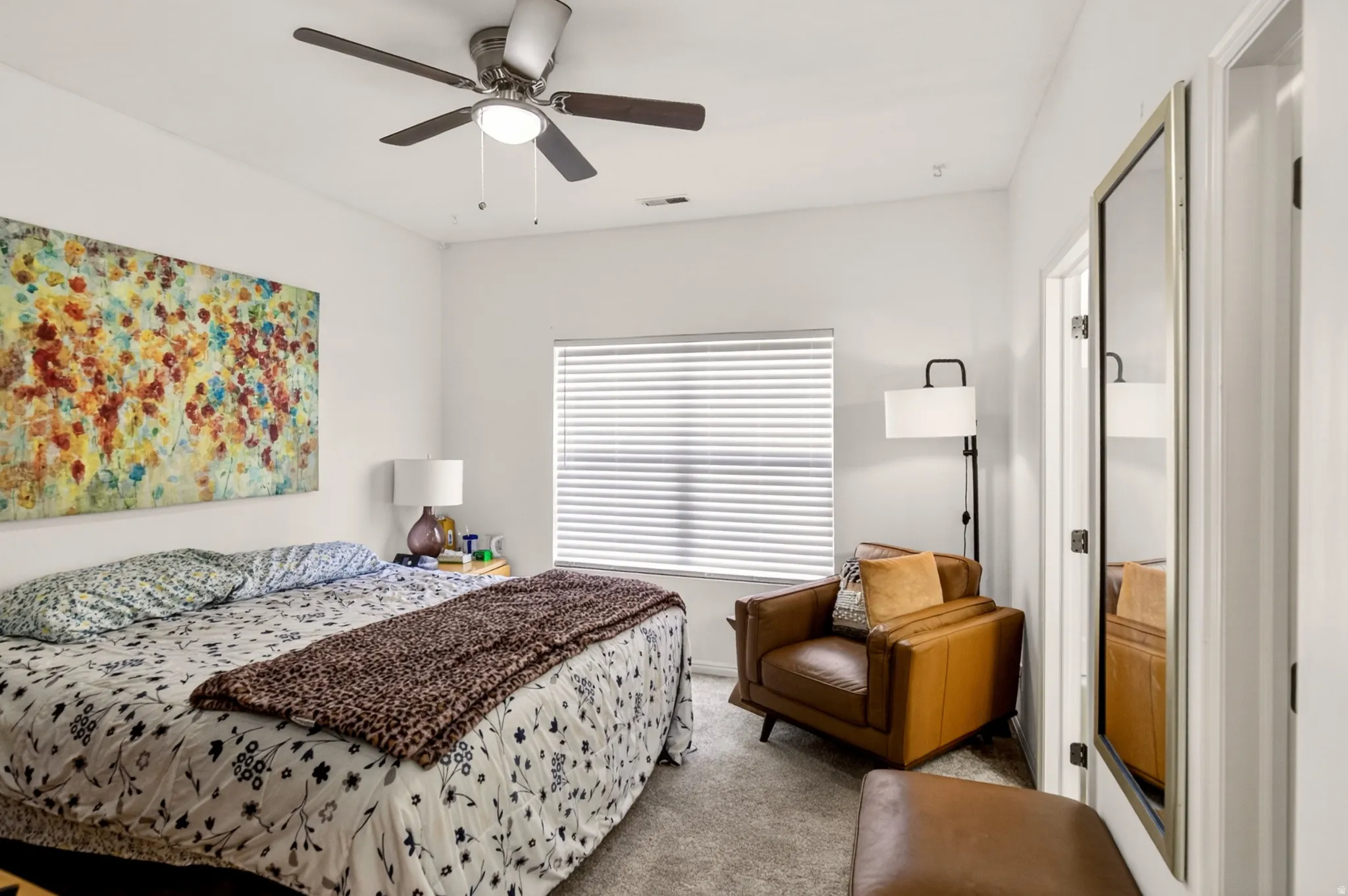 Primary Bedroom featuring carpet flooring and ceiling fan