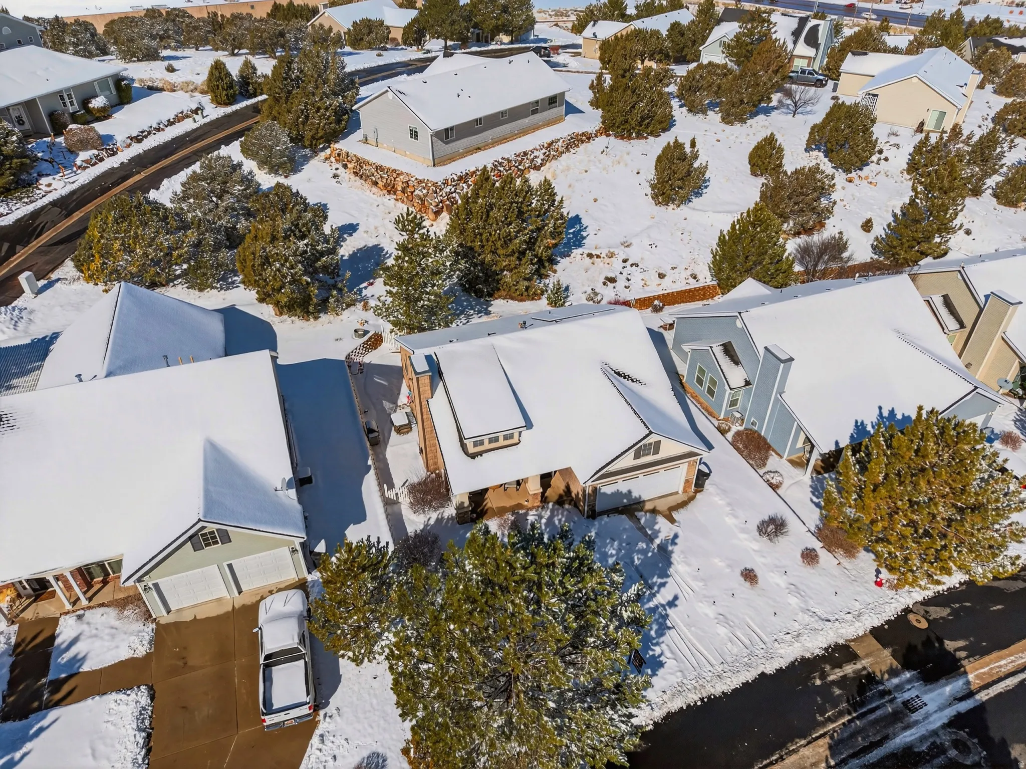 Snowy aerial view featuring a residential view