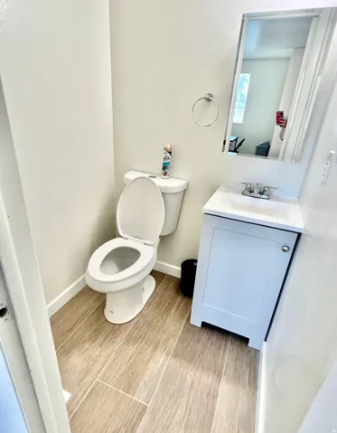 Bathroom featuring vanity and toilet
