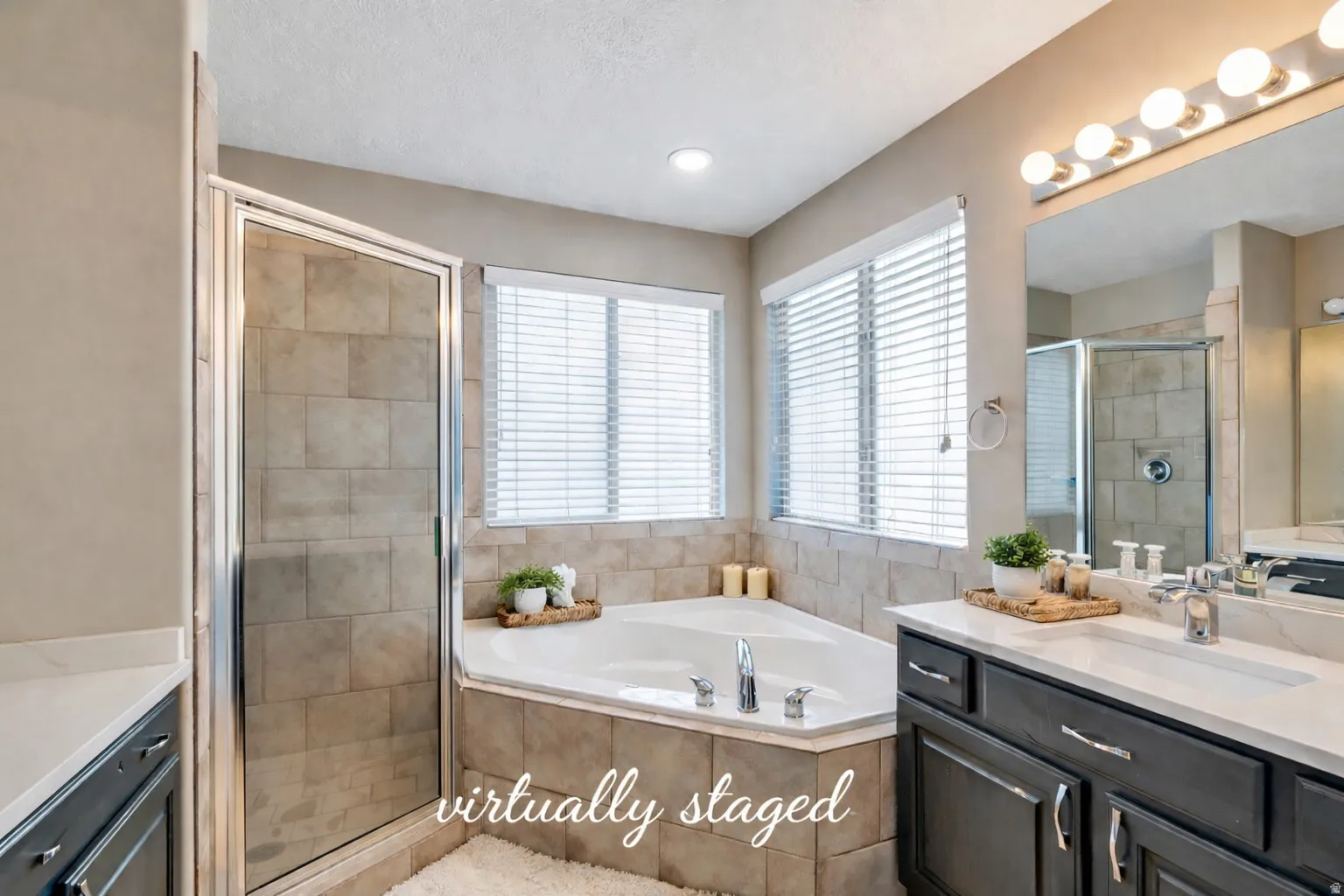 Full bath with vanity, a bath, and a shower stall