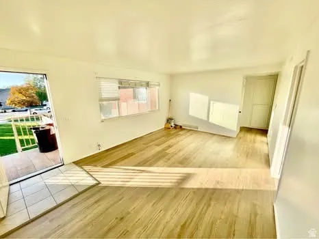 Unfurnished room with light wood finished floors