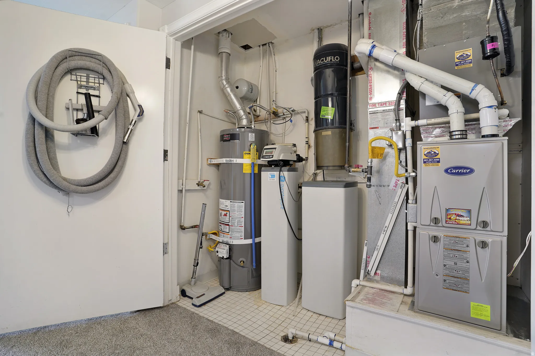 Utilities with secured water heater and a central vacuum unit