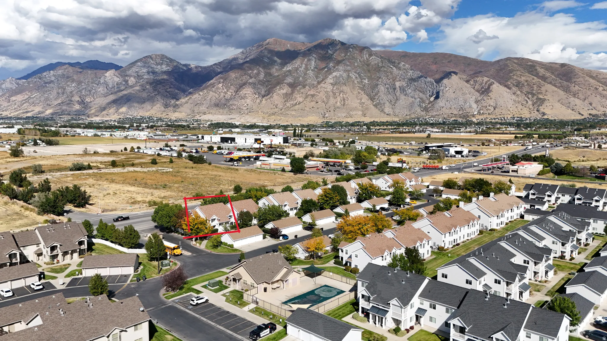 Aerial perspective featuring property parcel outlined and a mountain backdrop