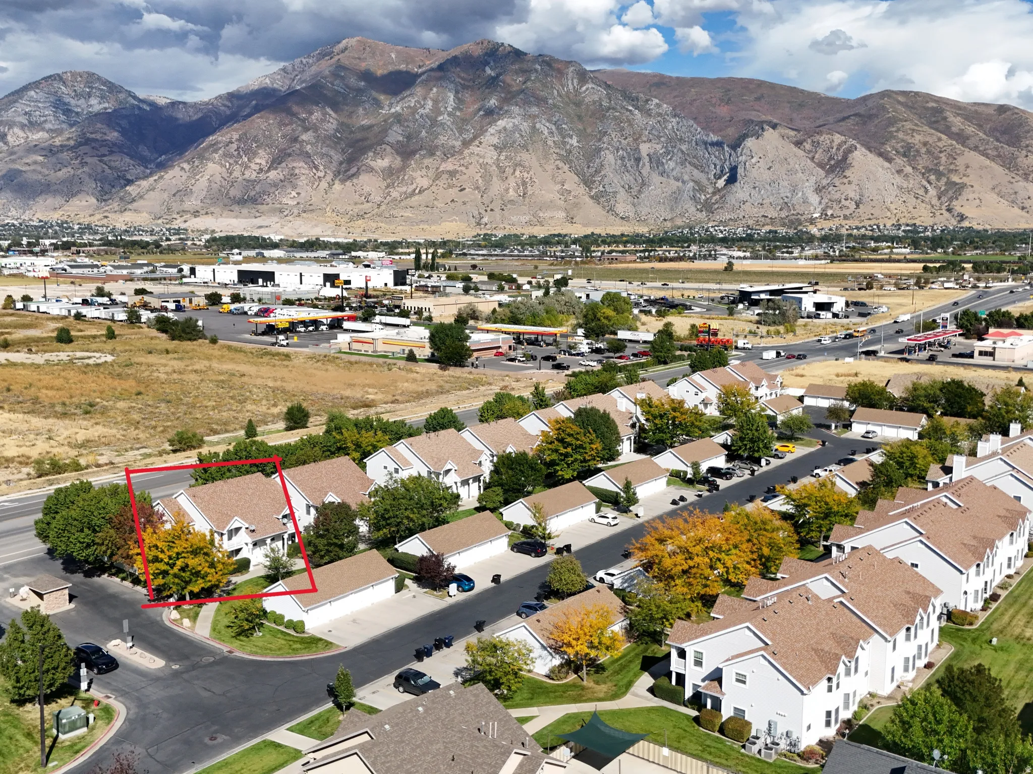 Aerial view of residential area featuring a mountain backdrop