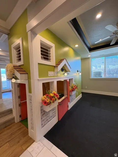 Game room with plenty of natural light, a ceiling fan, hardwood / wood-style flooring, and recessed lighting