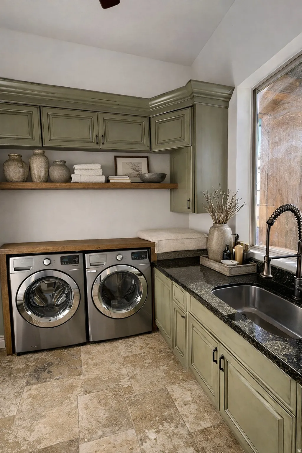 Laundry room with separate washer and dryer, light stone finish floors, cabinet space, and ceiling fan