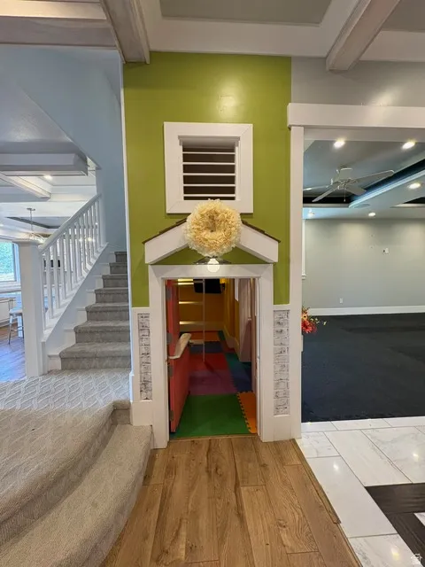 Detailed view of wood finished floors, recessed lighting, and carpet