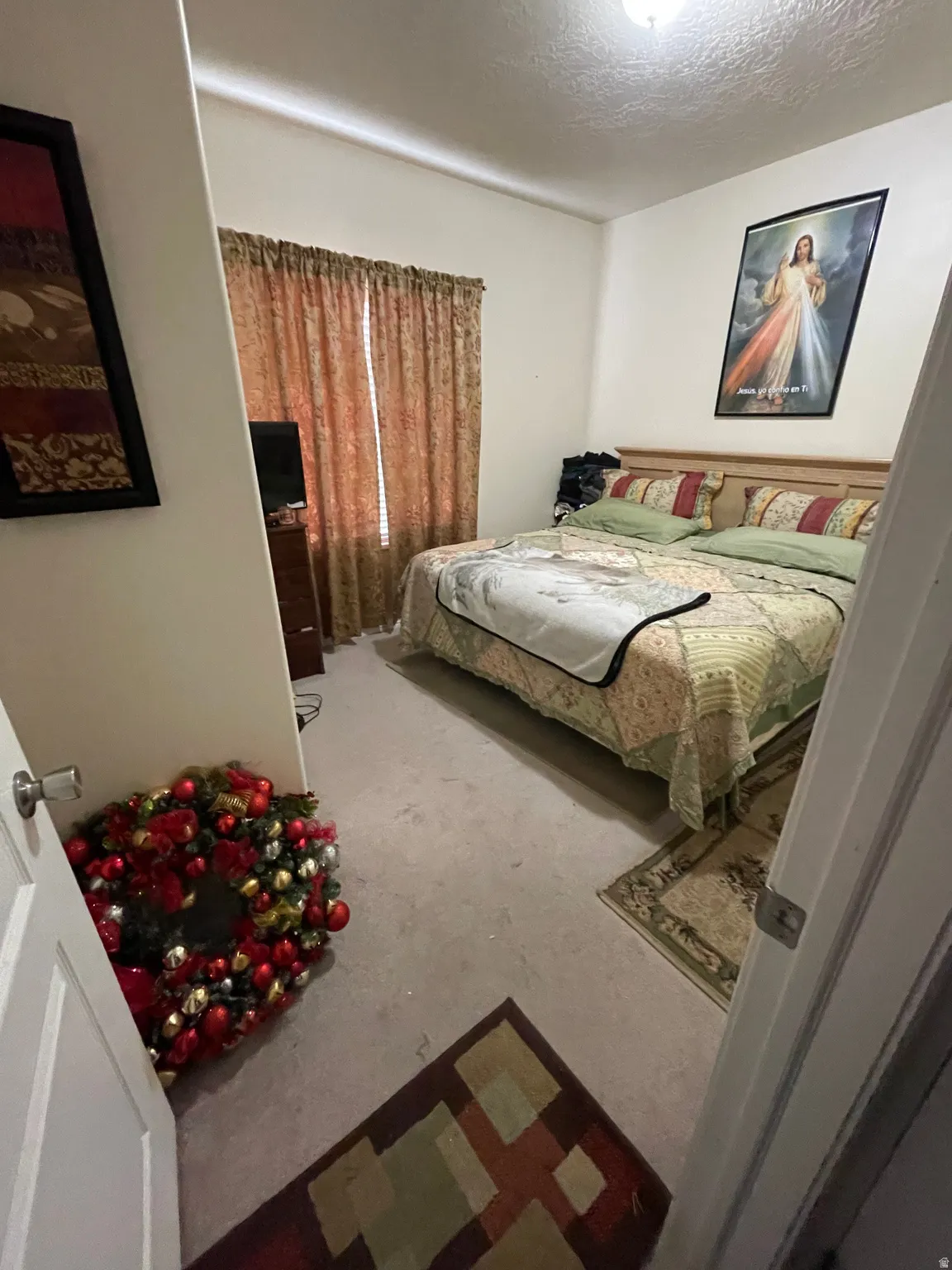 Bedroom featuring a textured ceiling