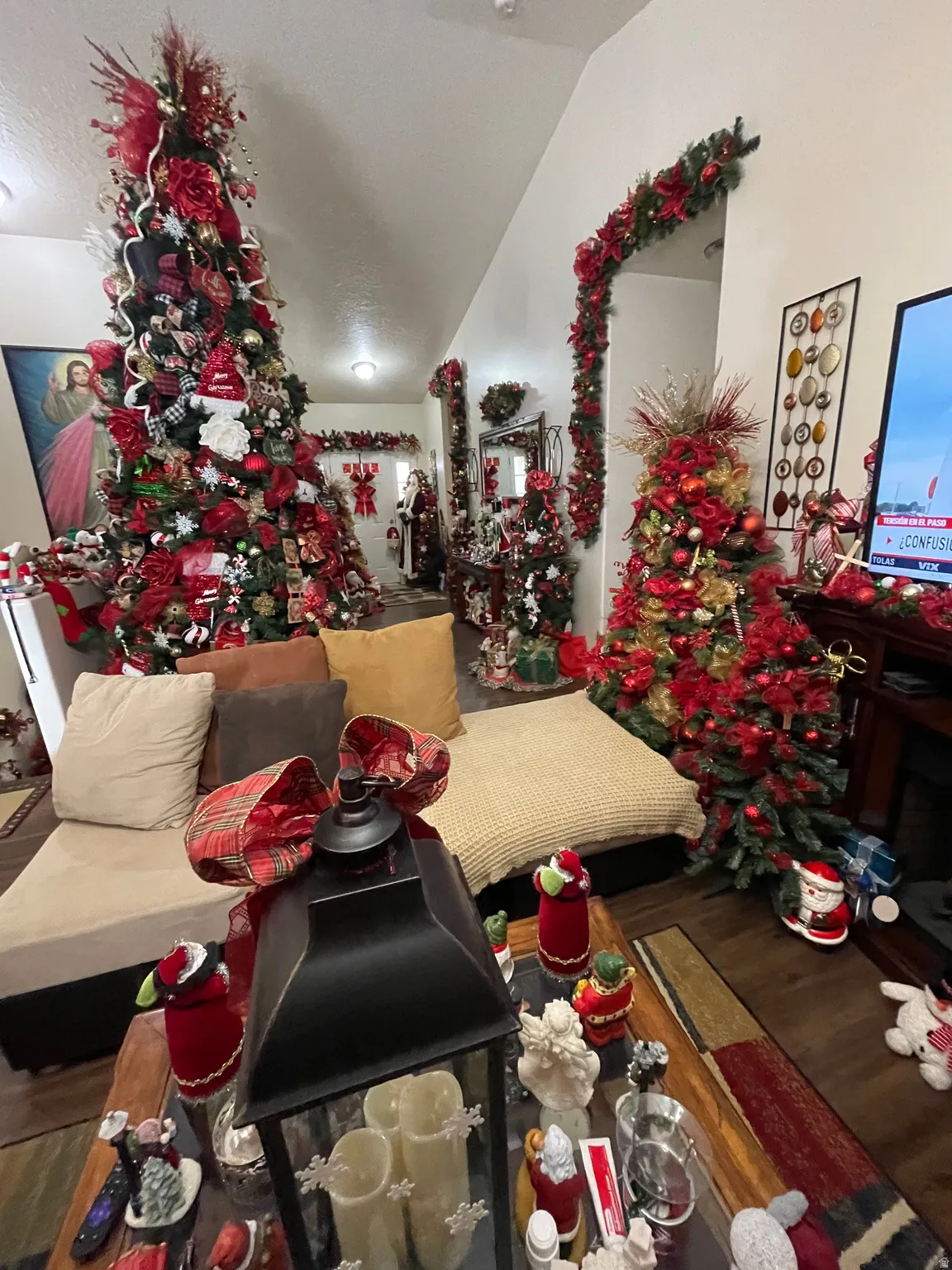 Dining room with wood finished floors and vaulted ceiling