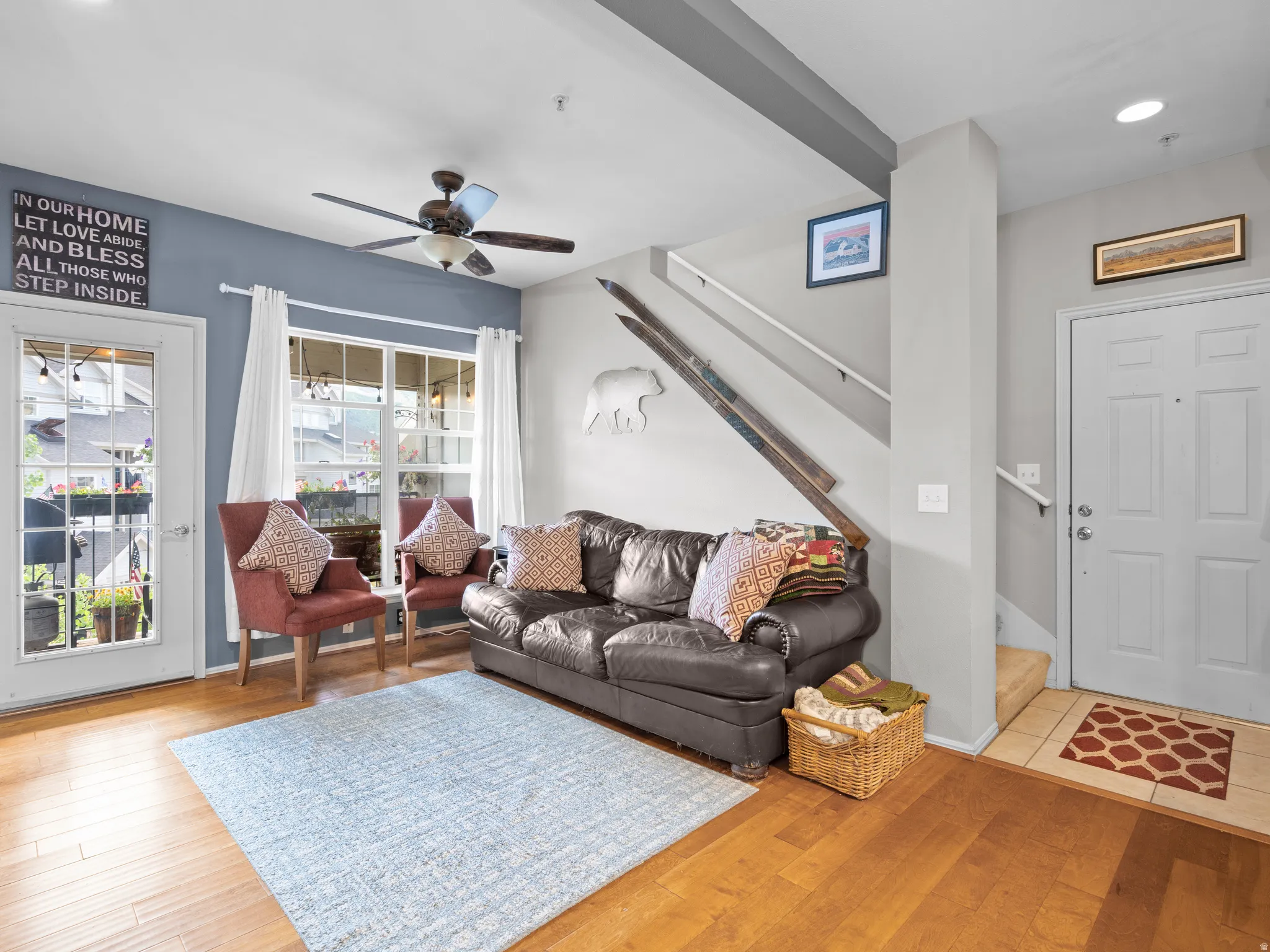 Living room featuring light wood-style floors, a ceiling fan, and recessed lighting