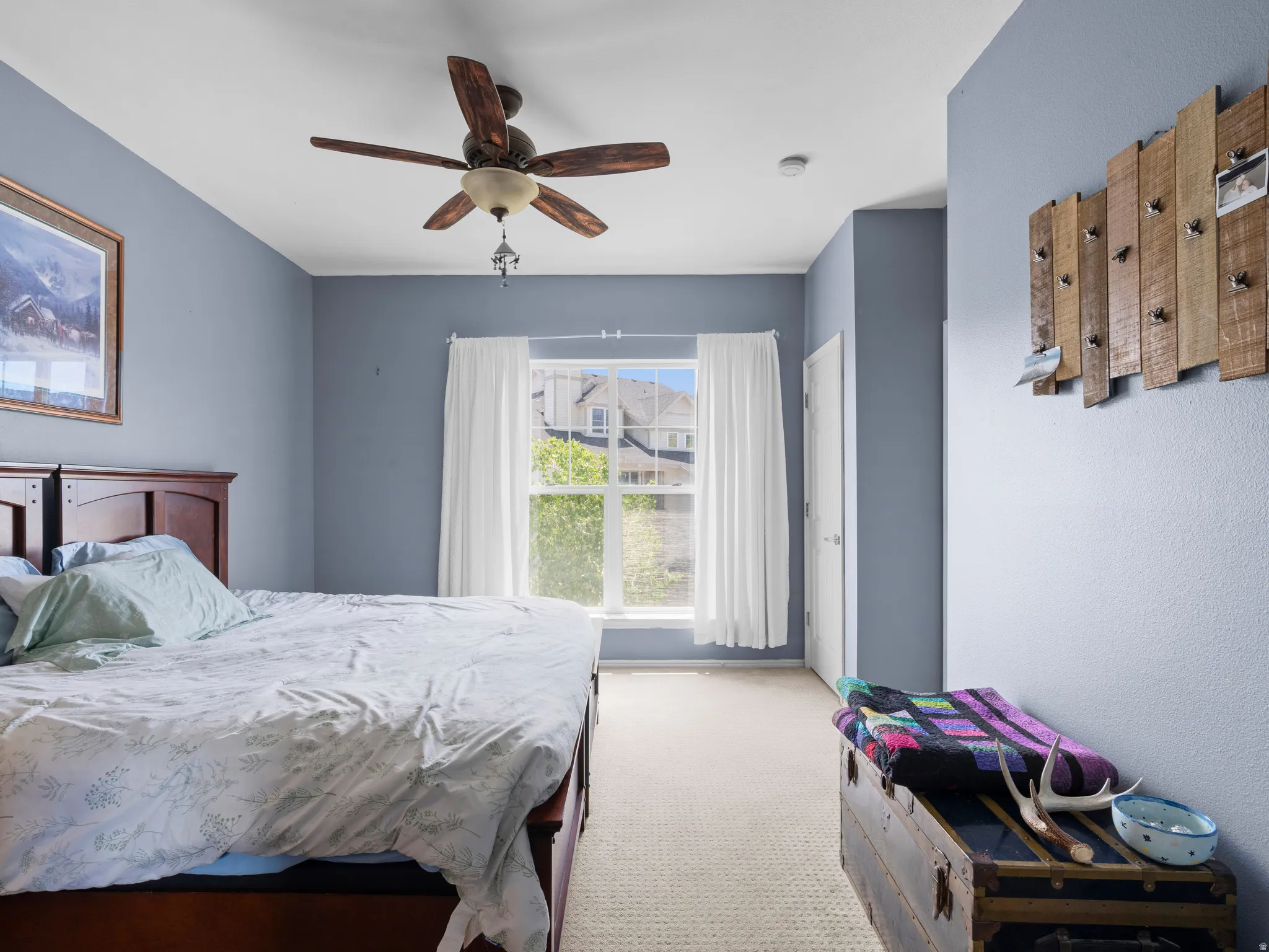 Bedroom featuring carpet flooring and a ceiling fan