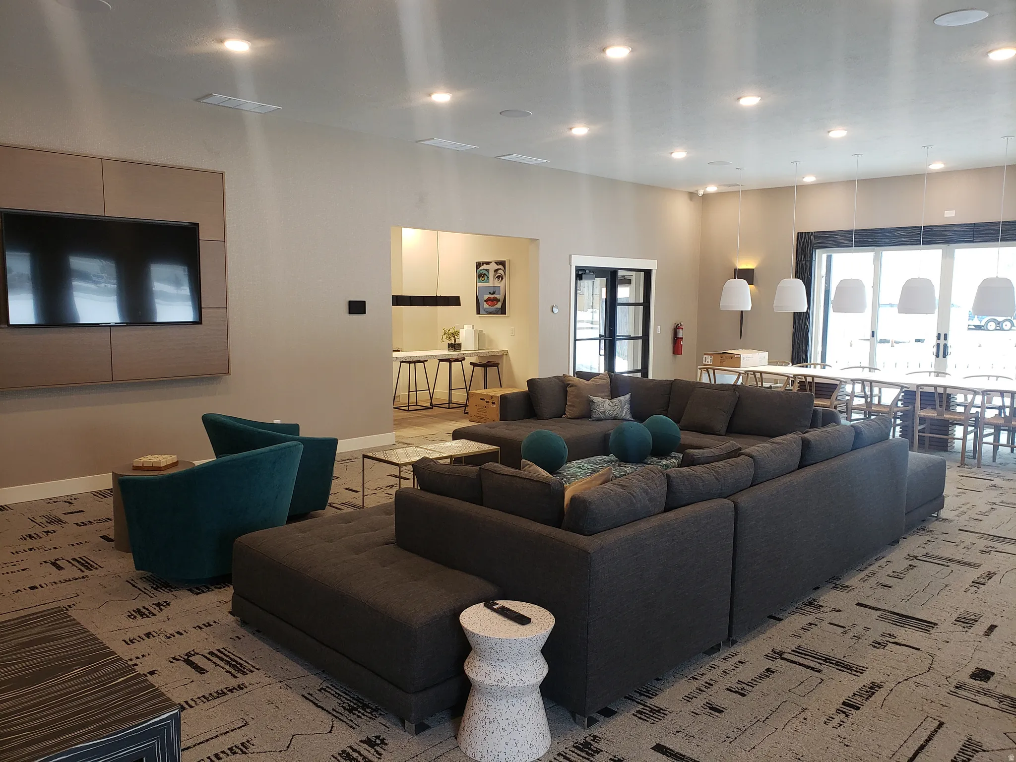Living room featuring recessed lighting and a high ceiling