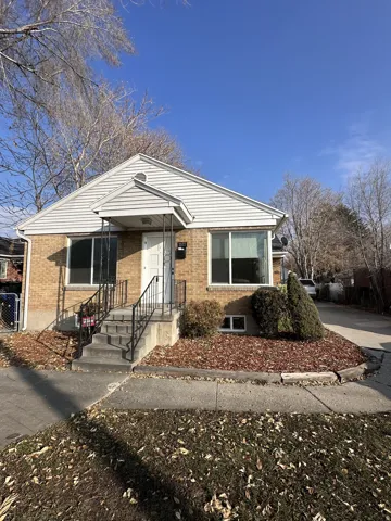 View of front of house with brick siding