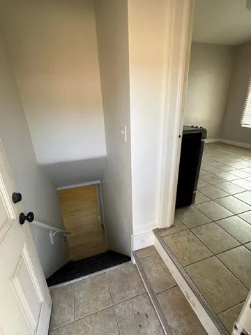 Bathroom featuring light tile patterned flooring and vanity