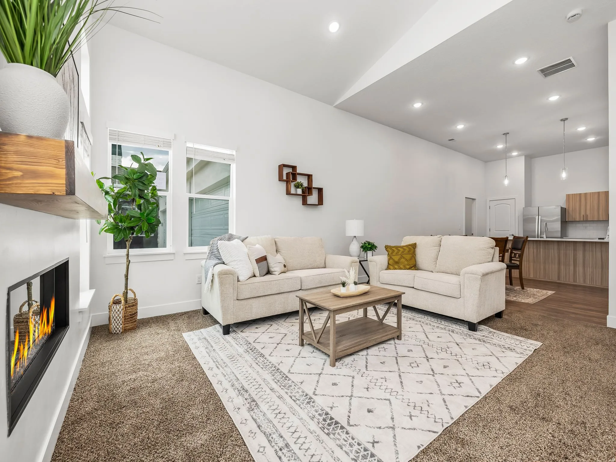 Great room with vaulted ceilings and cozy modern fireplace