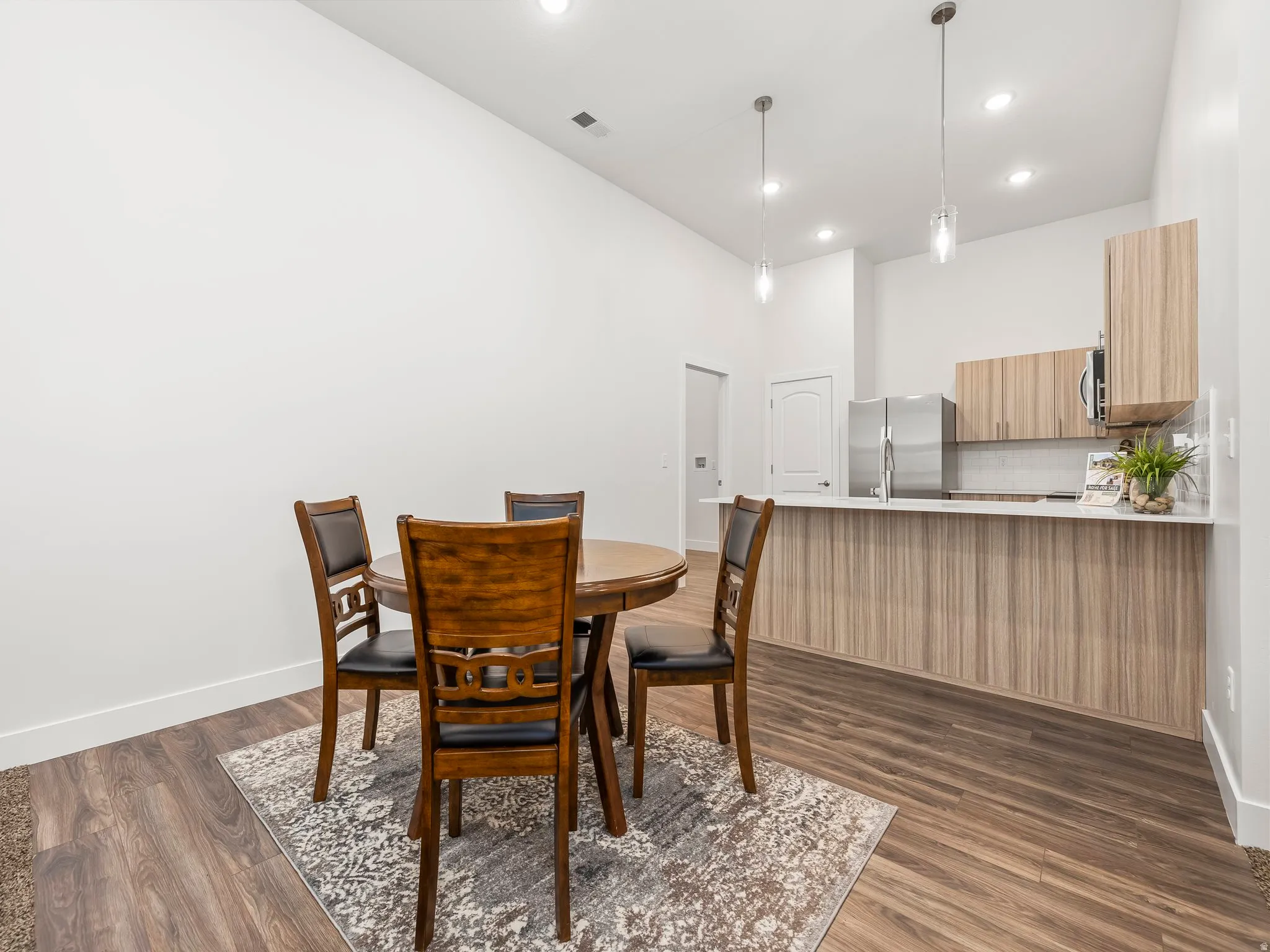 Great room opens to dining area and kitchen.
