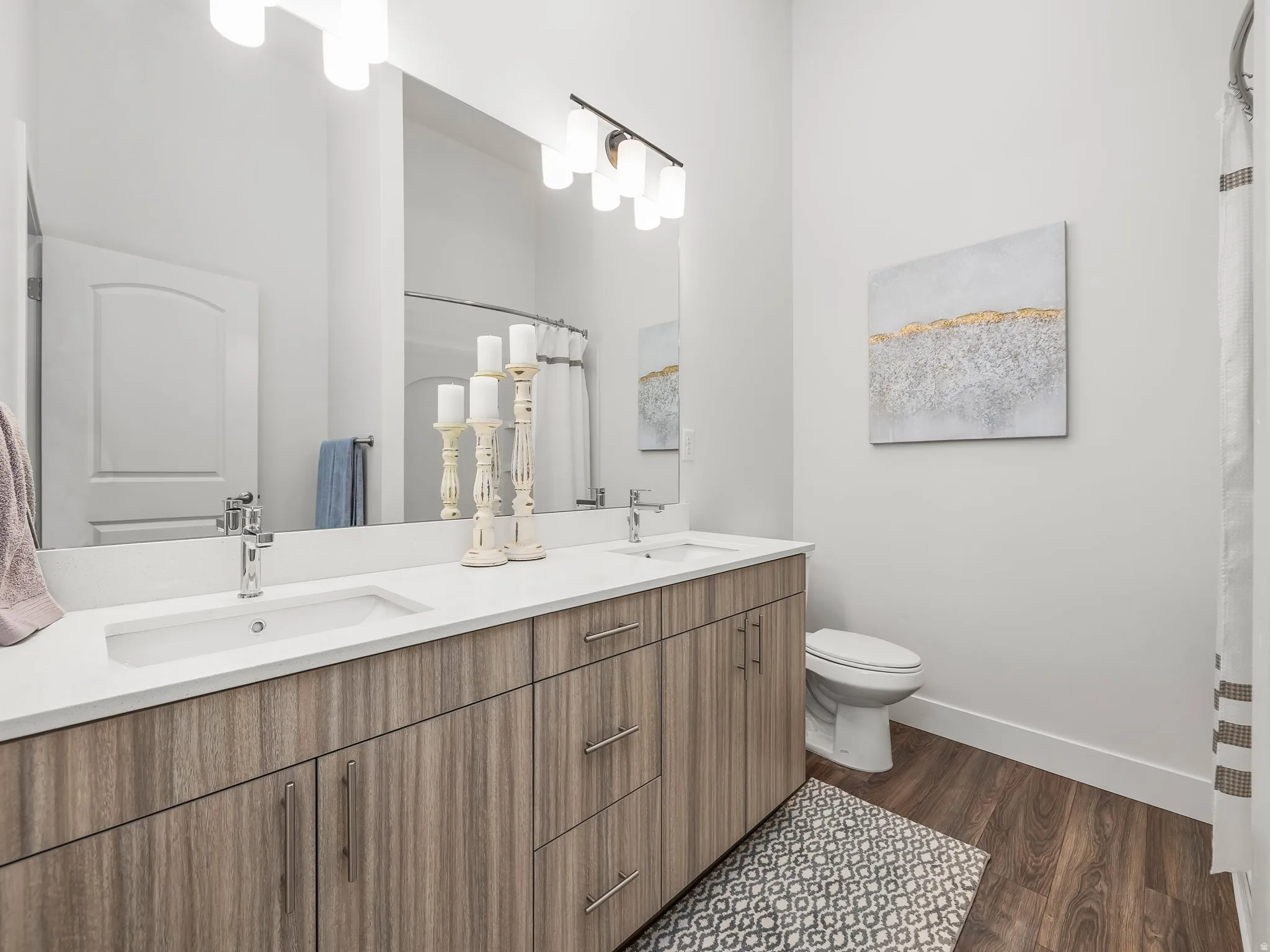 Primary bedroom en' suite with double vanity and walk in shower.