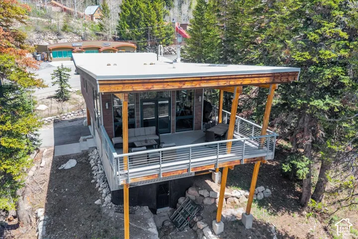 Back of property with private covered deck