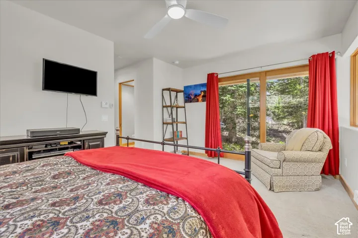 Primary suite featuring sliding glass door to a private covered deck
