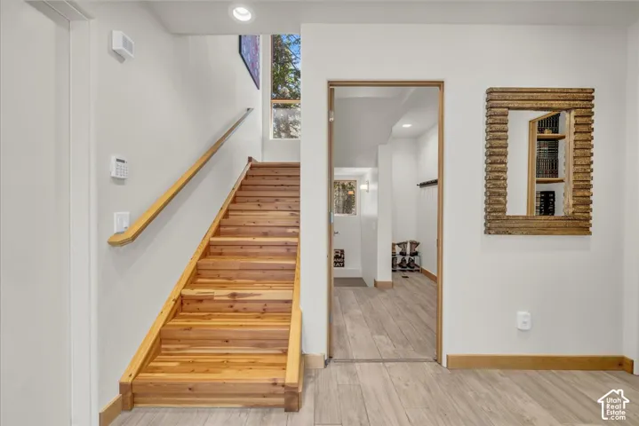 Main floor entryway leading to the dedicated ski/mud room and stairs to the great room