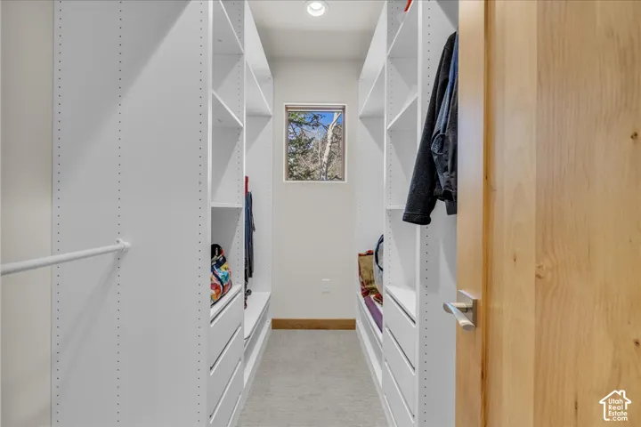 Primary bedroom walk in closet