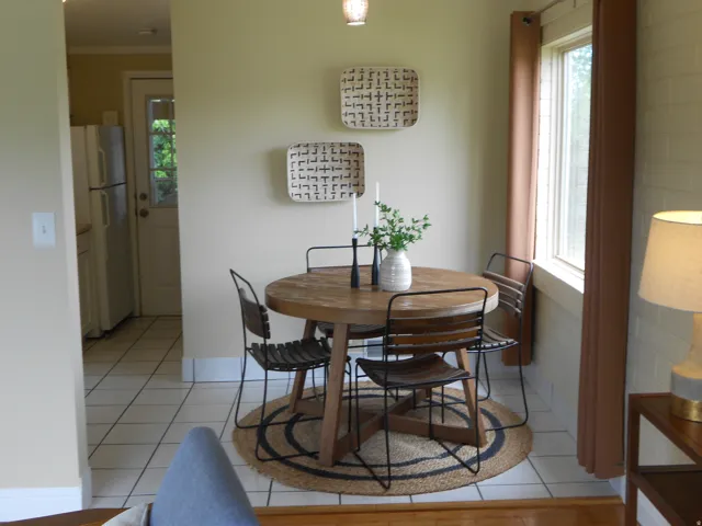 Dining room with light tile patterned floors and plenty of natural light
