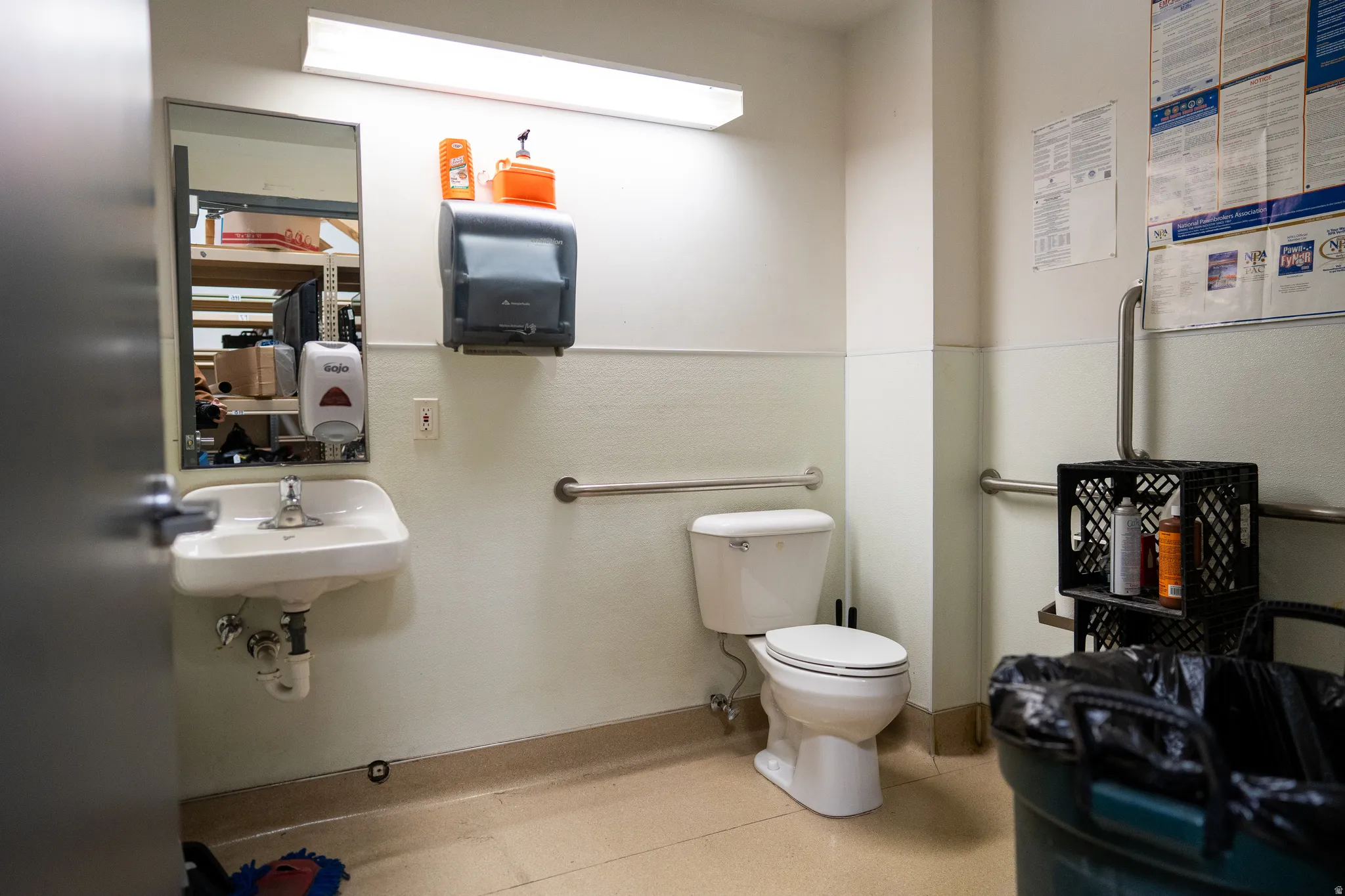 Half bathroom featuring toilet and a sink