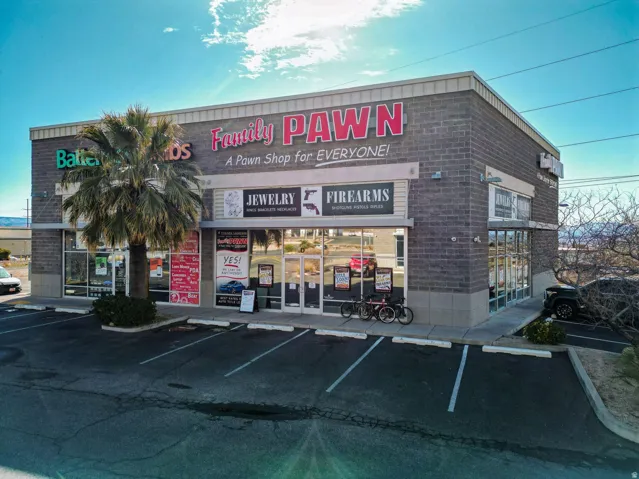 View of commercial location with uncovered parking