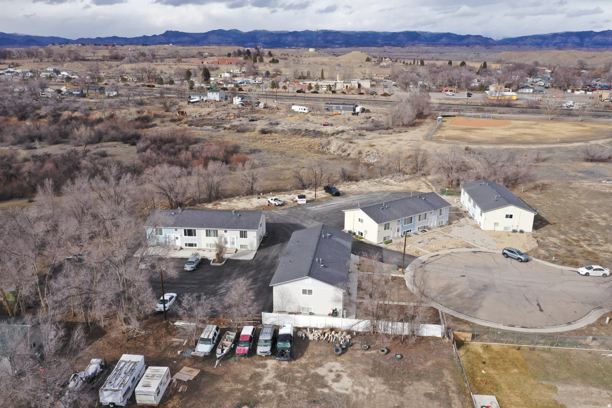 View of property location with a mountainous background and nearby suburban area