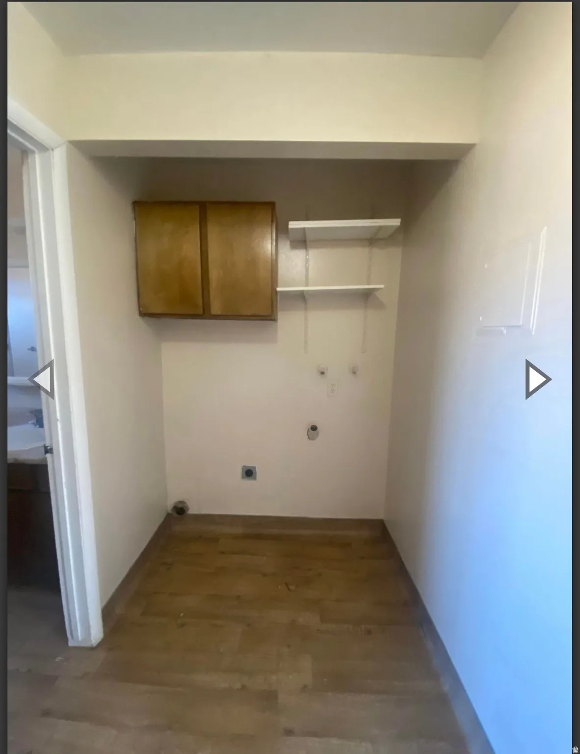 Laundry area with wood finished floors, cabinet space, electric dryer hookup, and hookup for a washing machine