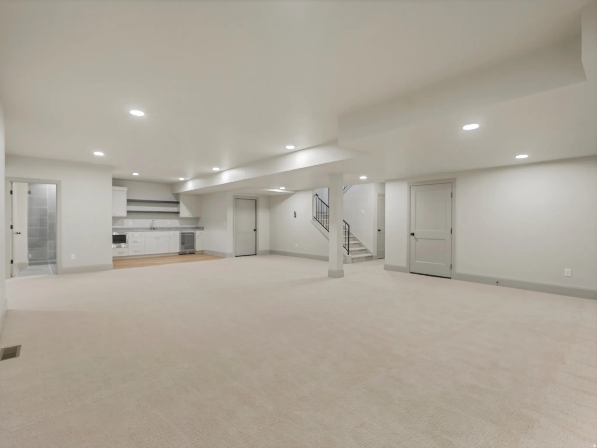 Finished basement featuring recessed lighting and light colored carpet