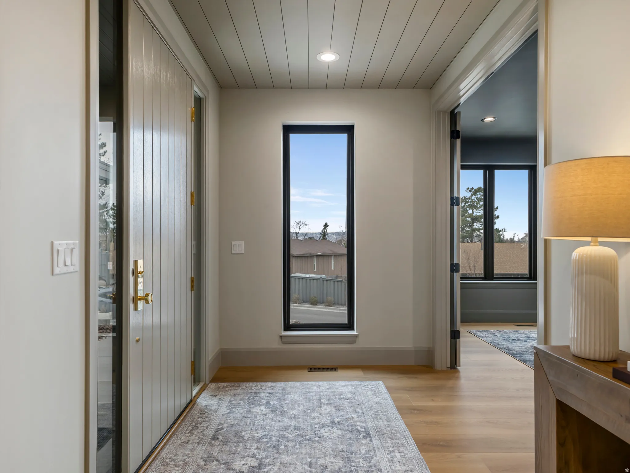 Entryway featuring light wood-style flooring and recessed lighting