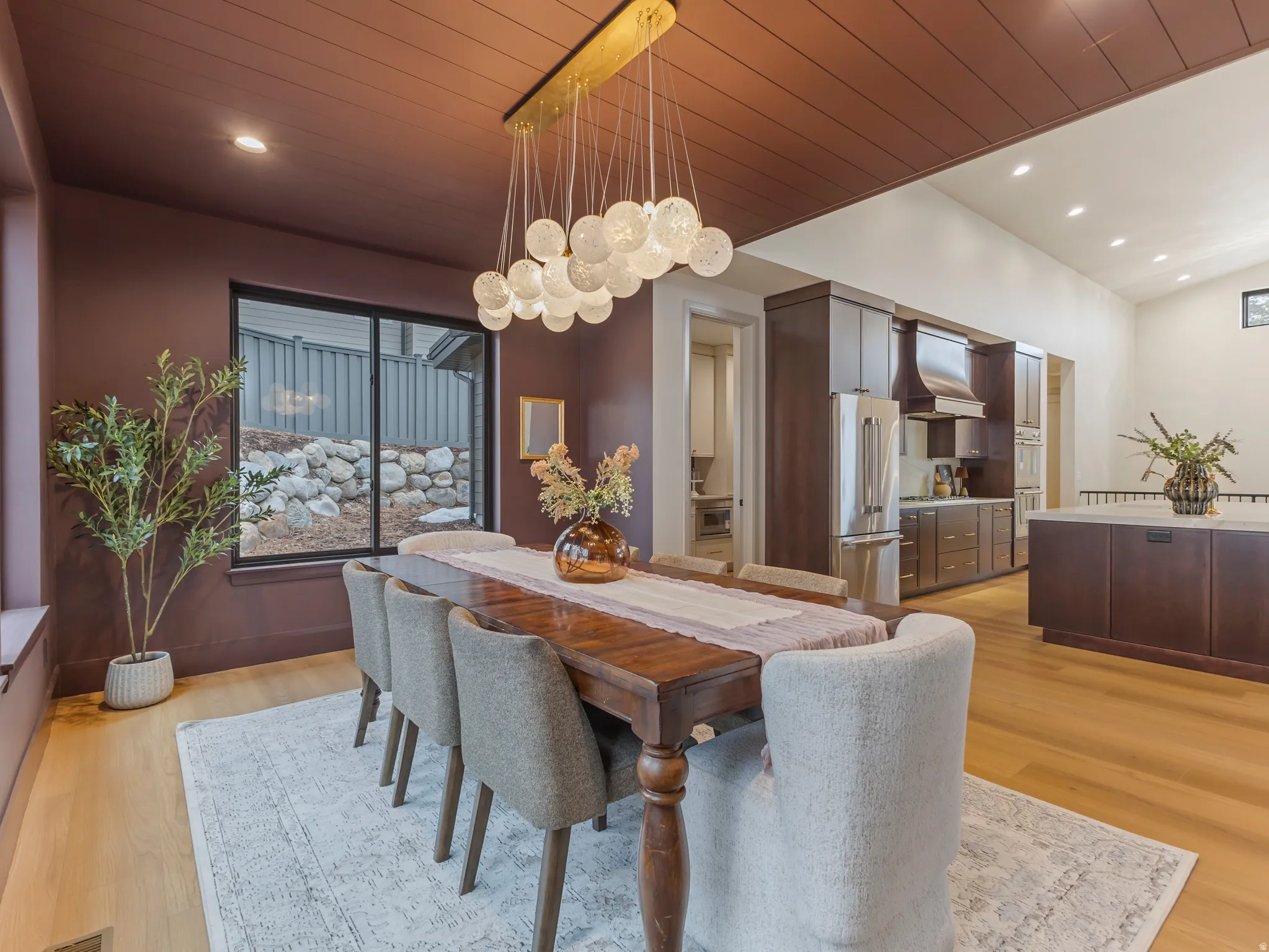 Dining room featuring recessed lighting, light wood-type flooring, and a vaulted wooden ceiling