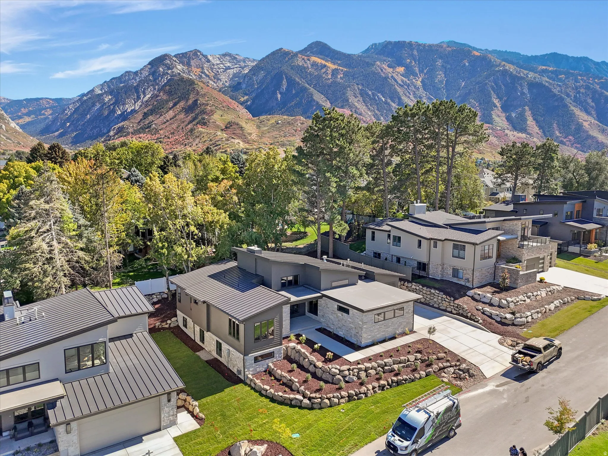 Aerial view of residential area featuring a mountainous background