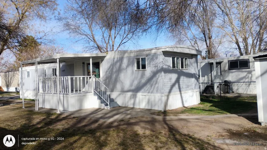 Rear view of property featuring covered porch